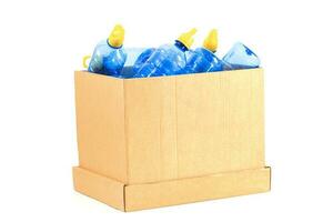 a box with a plastic bottle to be recycled on a white background photo