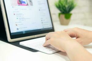 woman using a pc to communicate on a social networking site photo