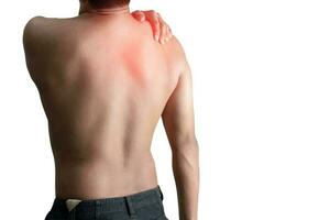 Young man holding back pain bone spine on a white background photo