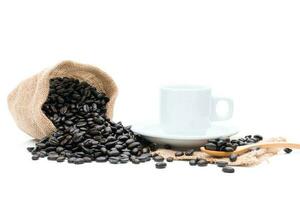 Roasted coffee beans in a sack of cloth on a white background photo