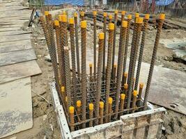 construction industry foundation drilling of concrete piles with reinforcement photo