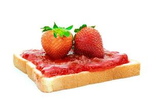 Strawberry and Jam on white background. photo