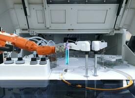 Robots in the medical lab, Mechanical arm holding test tube photo