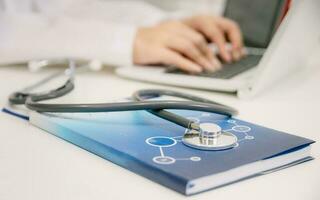 Medical stethoscope placed on the doctor's table photo