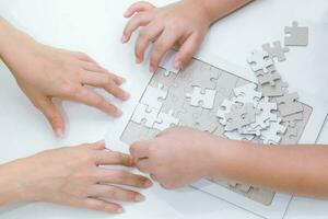 Adults and children development to jigsaw the skills, ideas, abilities photo