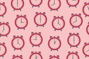 Seamless pattern of alarm clocks. Vector illustration in a flat style,