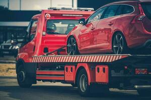 Broken Car on a Towing Truck photo