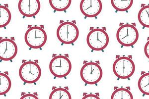 Seamless pattern of alarm clocks. Vector illustration in a flat style,