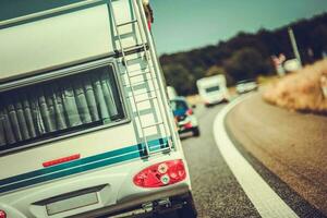 RV Traveling On Busy Road. photo