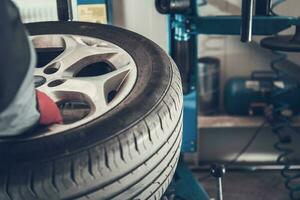 Mechanic Getting Ready To Replace Car Tire. photo