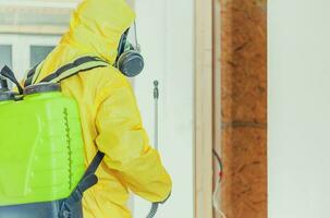 Hazmat Suit Worker Interior Disinfection Job photo