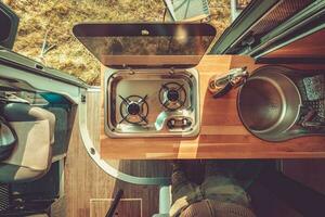 Men Preparing RV Camper Van Kitchen For Food Preparation photo