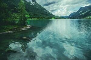 Landscape Of Norway Nature With Lake And Mountains. photo