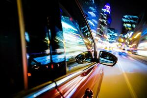 Driving Through City Lights photo