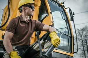 Excavator Digger Operator and His Machine photo