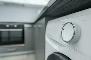 Modern Elegant Washing Machine Inside Apartment Kitchen Space photo