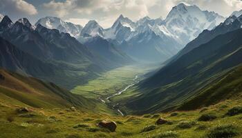 Majestic mountain range, tranquil meadow, panoramic beauty in nature photo