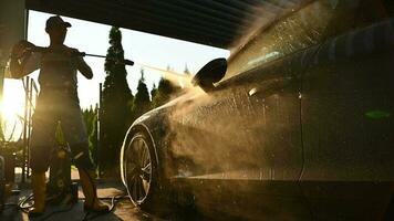 Washing Modern Luxury Car Using Powerful Pressure Washer. Automotive Industry. video