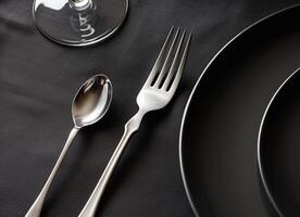 Shiny silverware set on elegant tablecloth for luxurious dining experience generated by AI photo