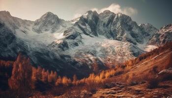 Majestic mountain range, snow capped peaks, tranquil meadow, autumn foliage generated by AI photo