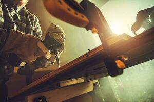 Woodwork Performed by Man Inside His Shed photo