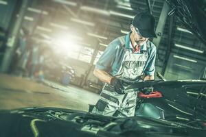 Automotive Technician Inside Dealership Car Service Area photo