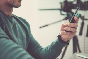 Men Using Mobile Application on His Smartphone photo