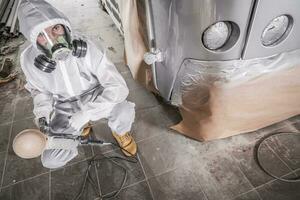 Auto Body Repair Worker Preparing For Polishing photo