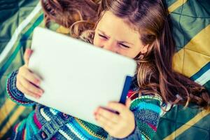 Girl Watching Movie on Tablet photo