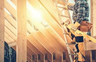 Construction Contractor Worker with Spirit Level in His Hand photo
