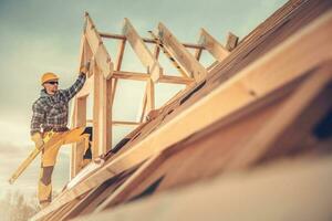 New Wooden House Construction Worker photo