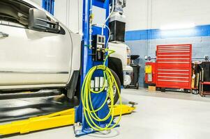 Car Maintenance Service Station with Automotive Lift photo