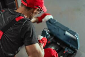 Contract Worker Preparing His Power Tools photo