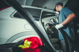 Vacuuming Station Worker photo