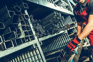 Metalworking Warehouse with Shelves Full of Metal Profiles and Tubes photo