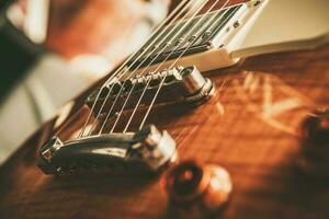 Elegant Exotic Wood Made Electric Guitar Close Up photo