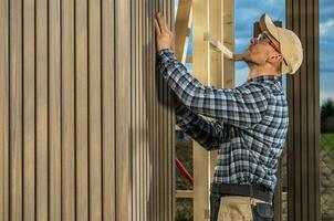 Caucasian Woodwork Worker Building Modern Garden Shed photo