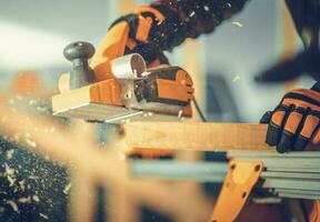 Carpenter with Corded Planer photo