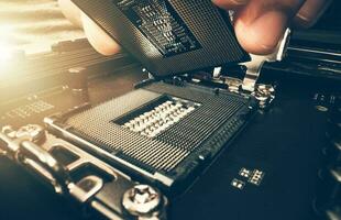 Computer Technician Installing New Modern Processor photo