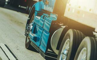 American Semi Truck on a Interstate Highway Close Up photo