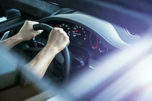 Driver Behind Supercar Steering Wheel photo