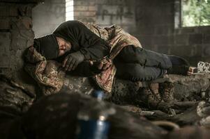 Homeless Men Sleeping Inside Abandoned House photo