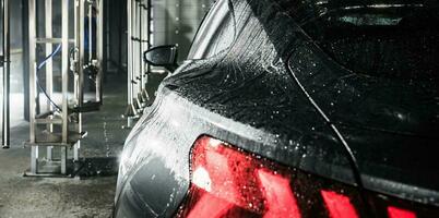 Modern Vehicle Inside a Touchless Car Wash photo