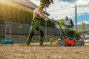 Gardener with Gasoline Engine Aerator photo