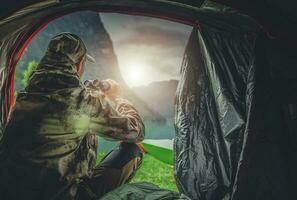 Hunter in His 40s Spotting Wildlife Using Binoculars photo