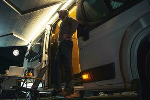 Traveler Enjoying Quiet Evening by His Motorhome photo