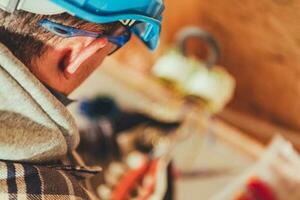 Caucasian Worker in Blue Hard Hat photo