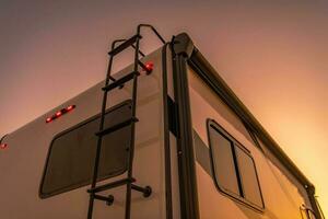 Modern Recreational Vehicle in the Sunset Lights photo