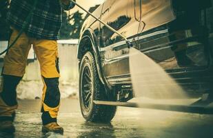 Contractor Worker Washing His Commercial Truck photo