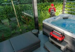 Spa Technician Performing Hot Tub Checks photo